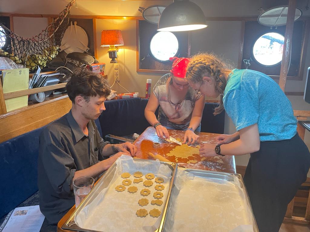 Students serving Christmas- Cookies in the messroom